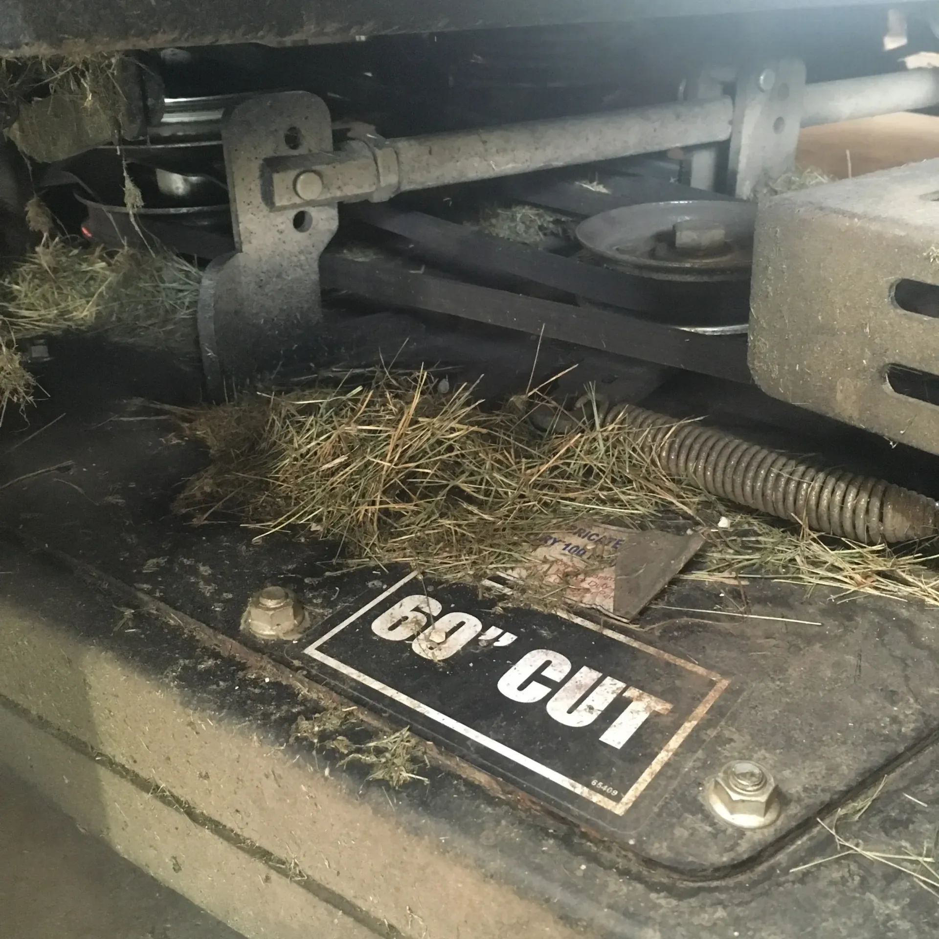 Close-up of a lawnmower deck labeled