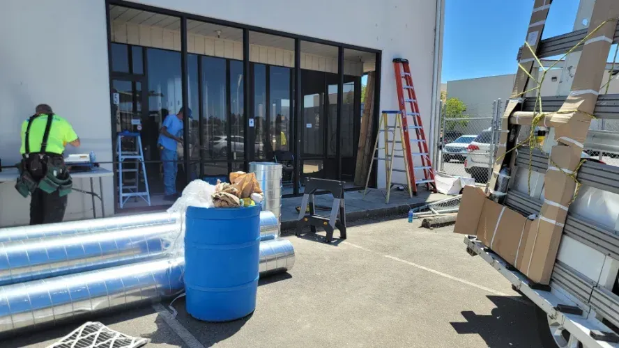 A general construction job in front of a building.