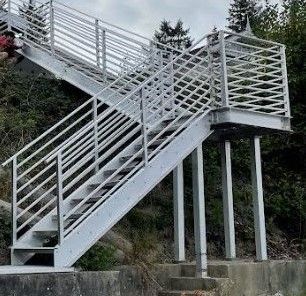 custom-metal-beach-access-staircase-being-installed 1