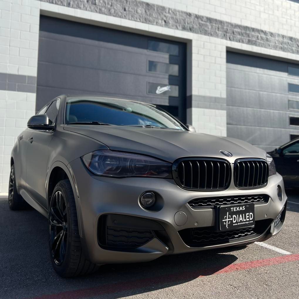 A bmw with a license plate that says ovaled