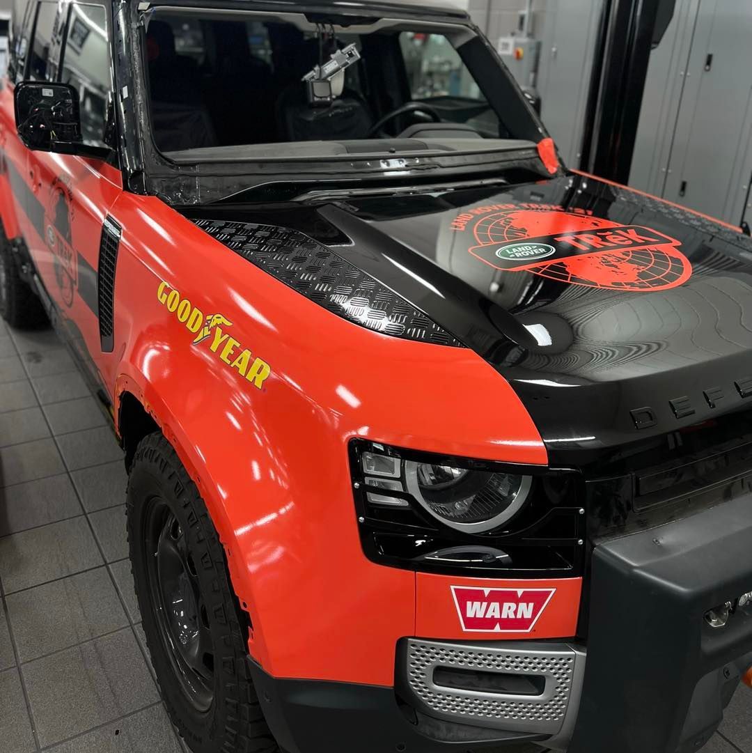 A red truck with good year written on the hood