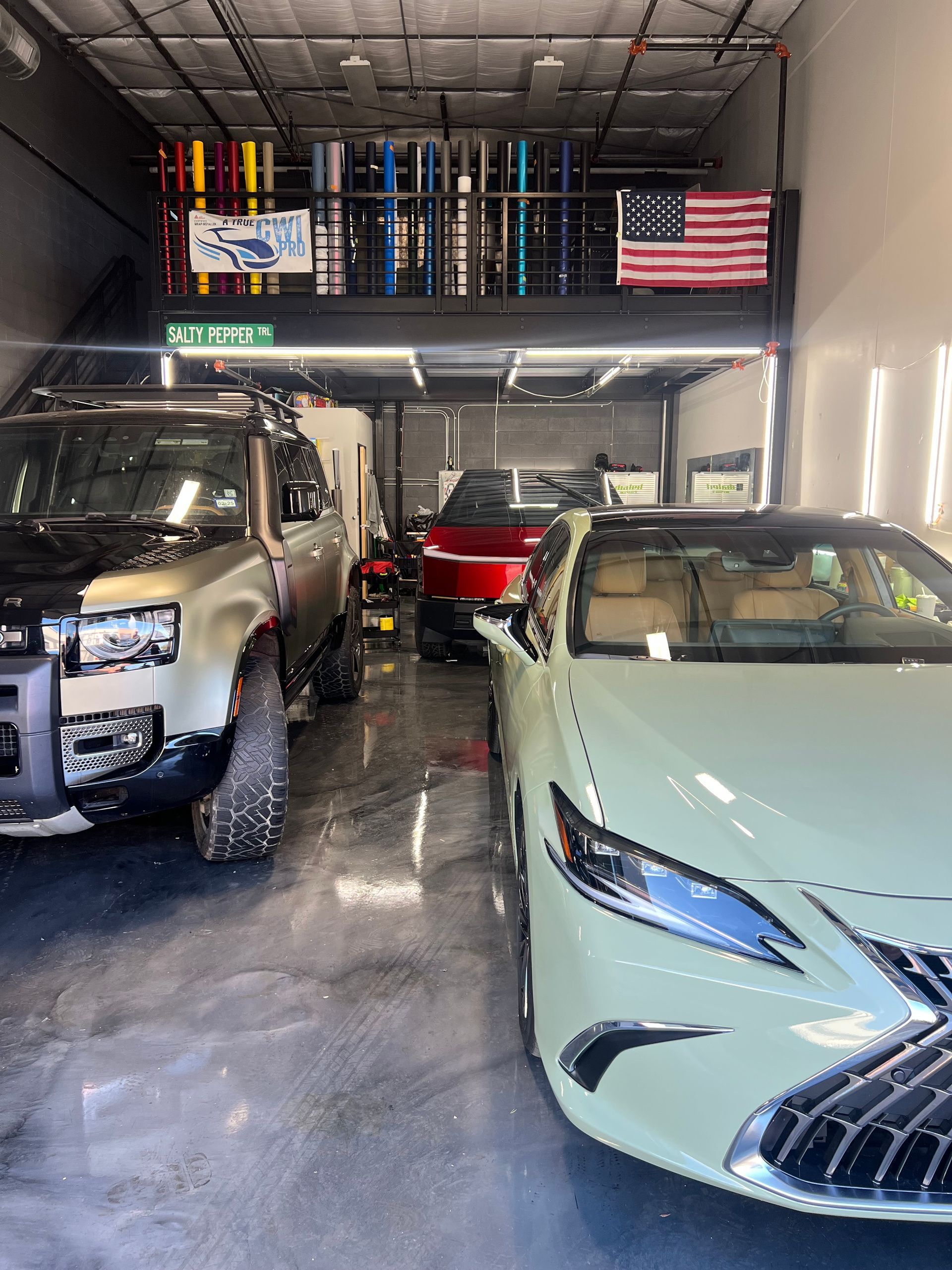 A lot of cars are parked in a garage.