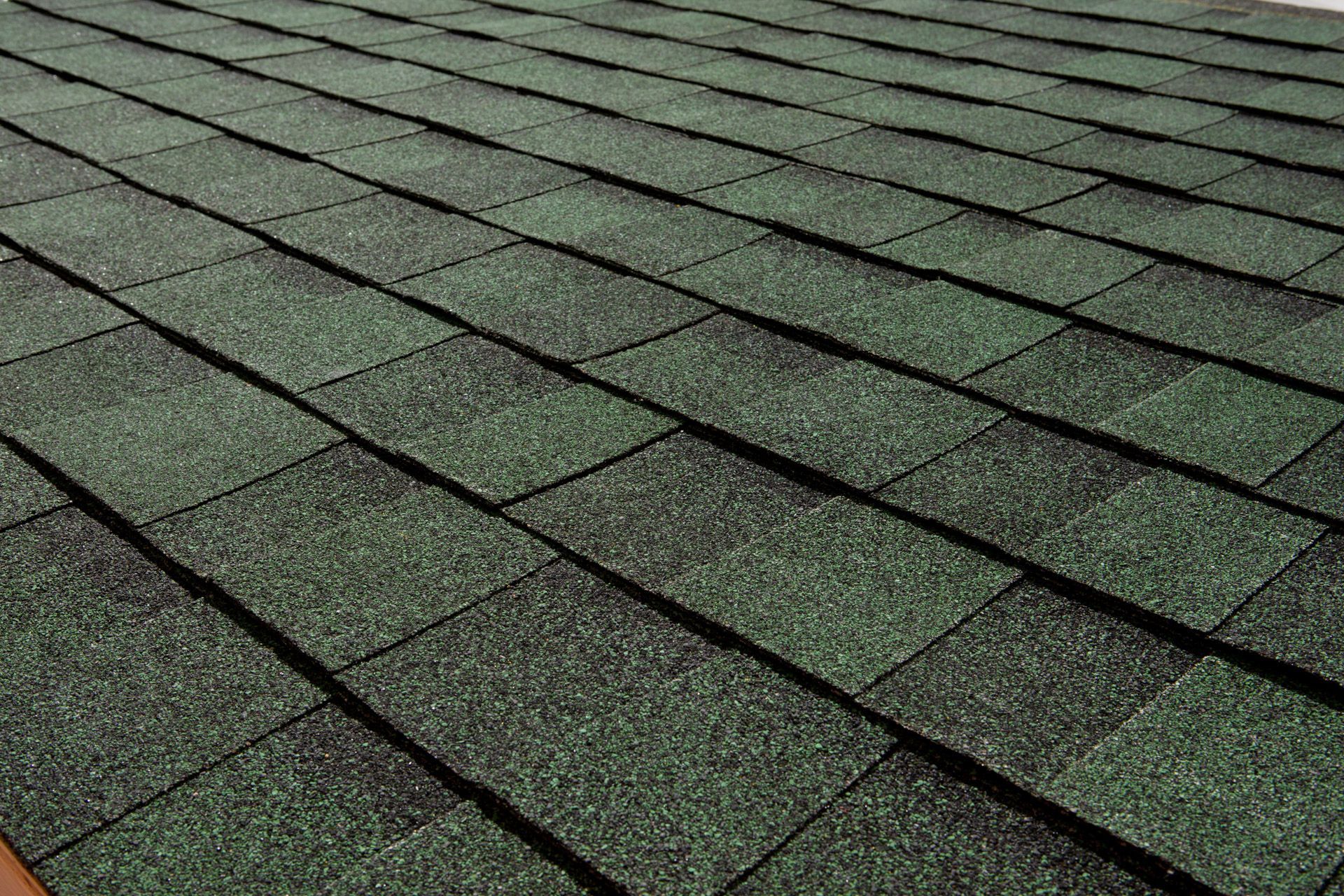 Green and black asphalt shingle roof.