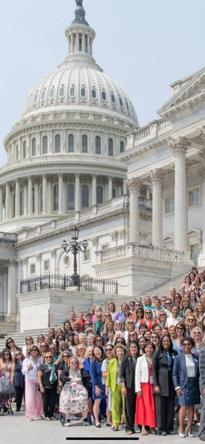Group photo of women on the steps of the US Capitol Building.