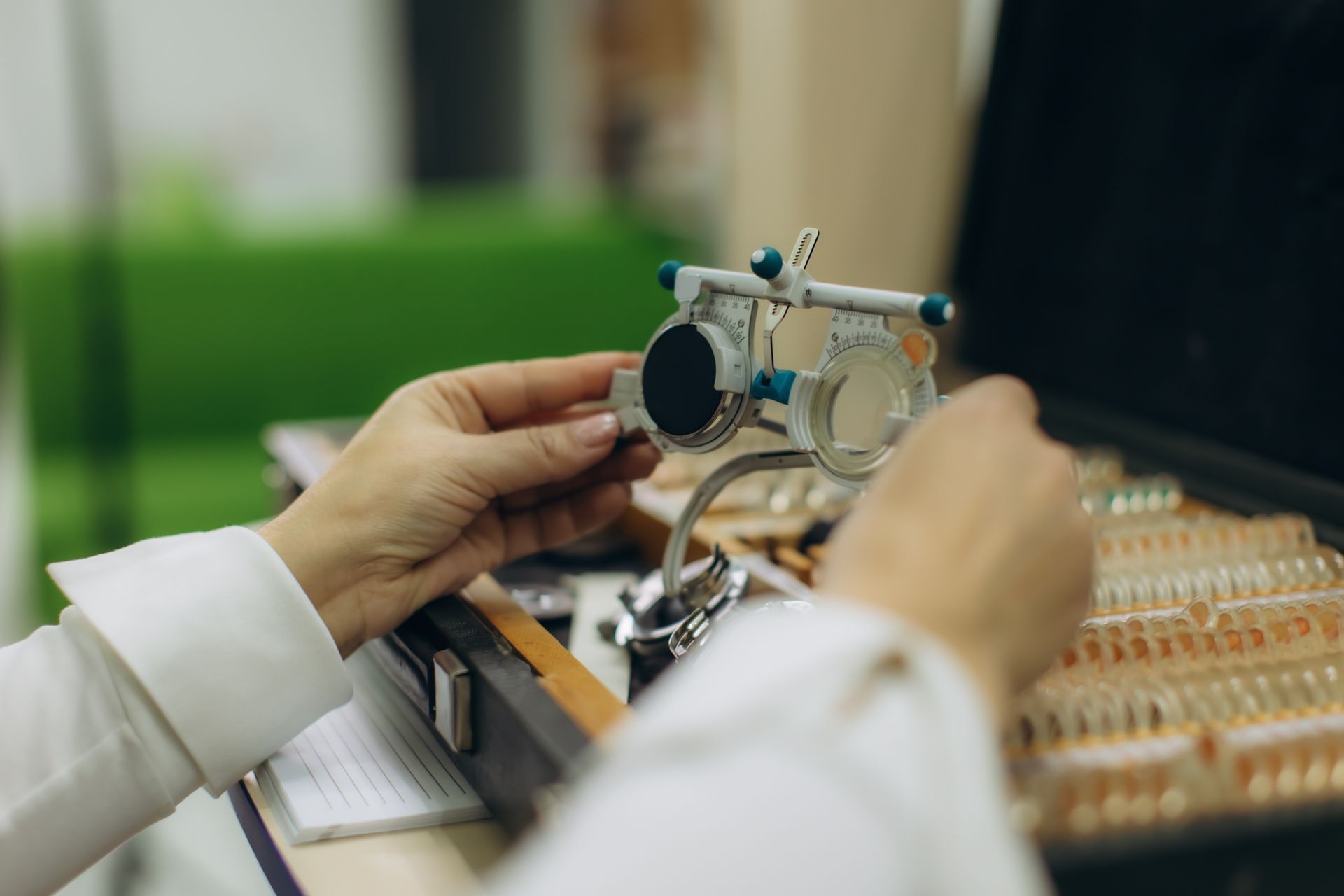 Optician preparing trial frame representing trusted optometric care for clear and accurate vision. Optician preparing trial frame representing trusted optometric care for clear and accurate vision.