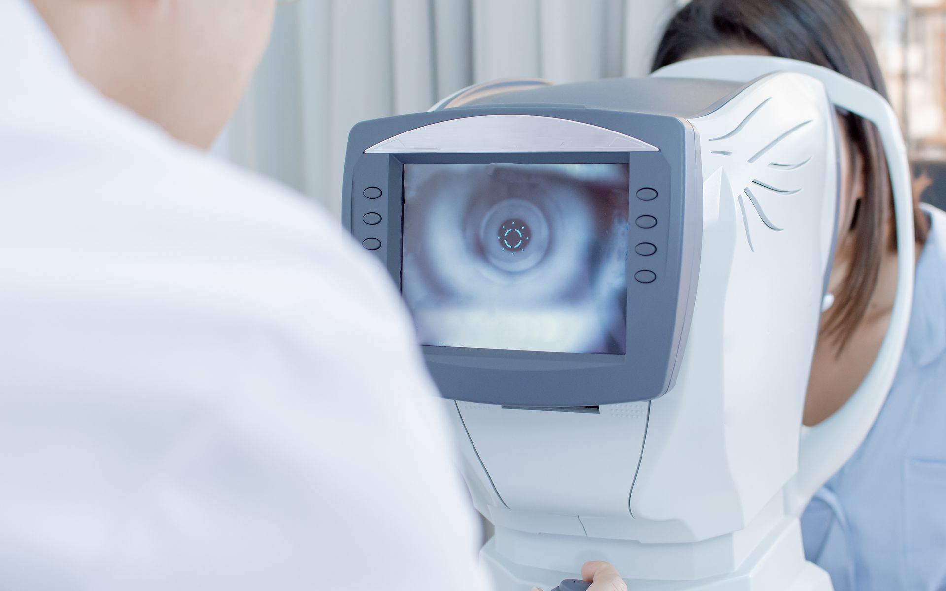 Eye Care Services exam being performed on a patient with an autorefractor. Eye Care Services exam being performed on a patient with an autorefractor.