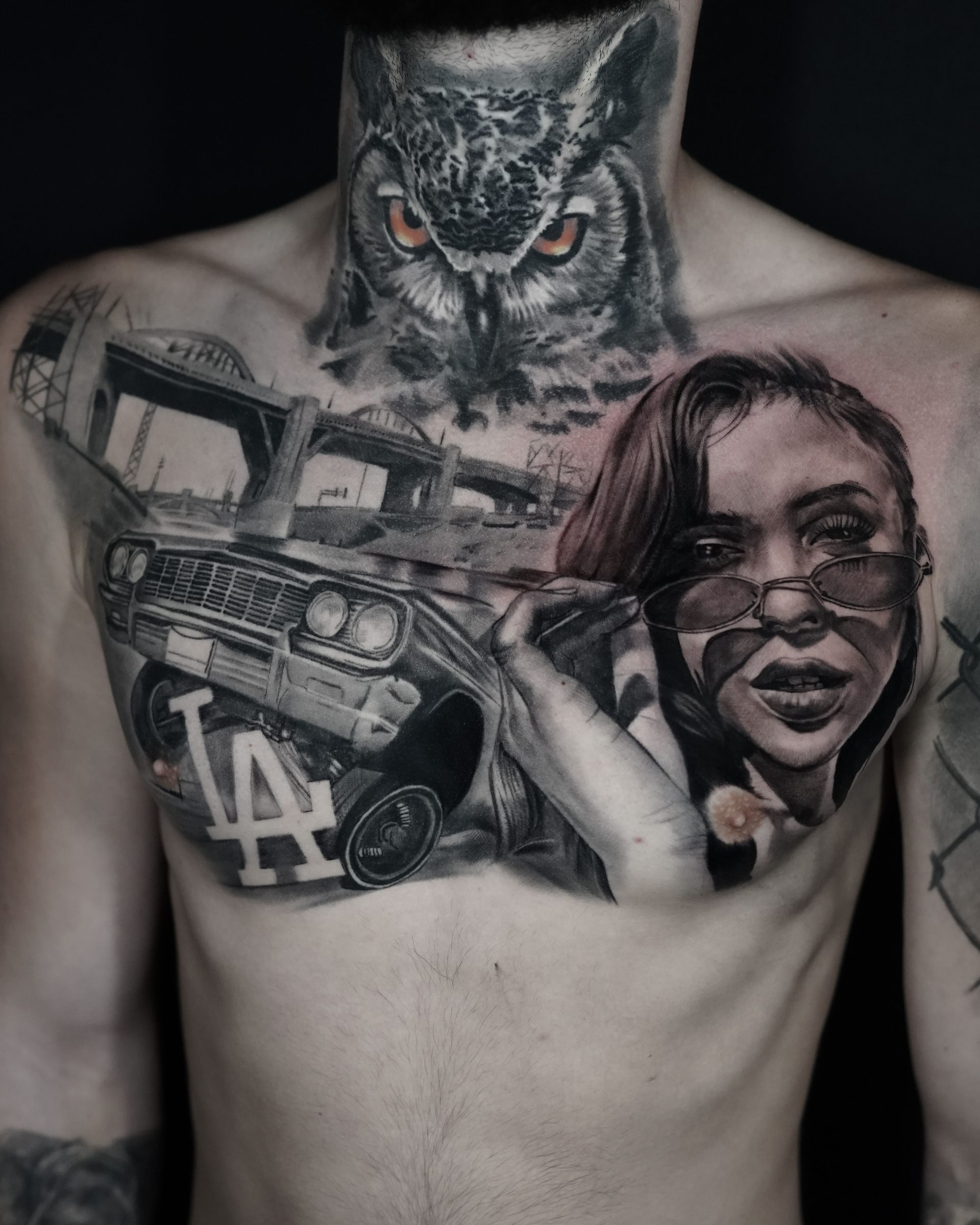 A man has a tattoo of an owl and a woman on his chest.