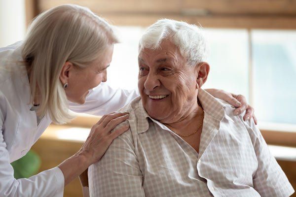 woman taking care of elderly man