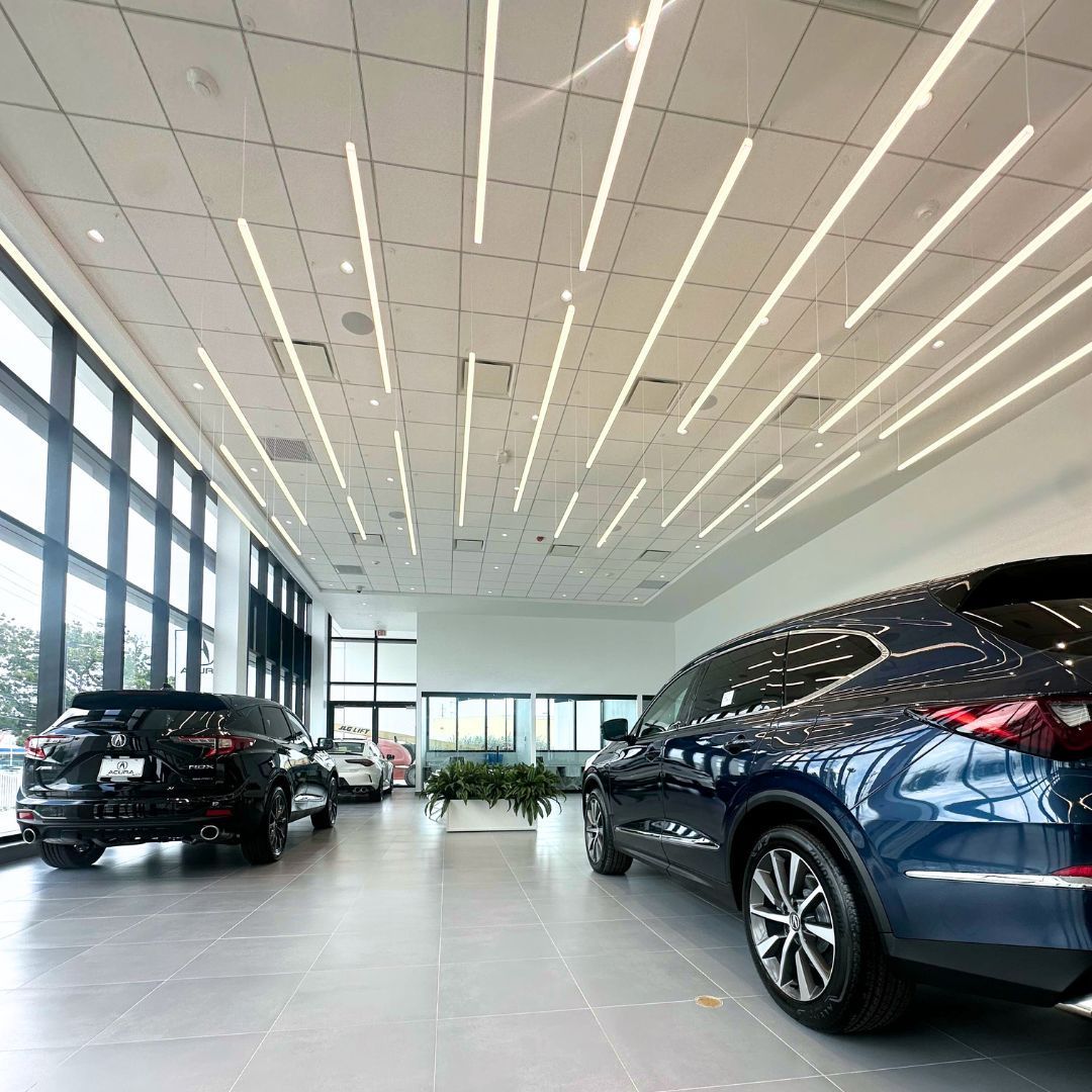 Cars are parked in a showroom with a good lighting built by DEV Builders