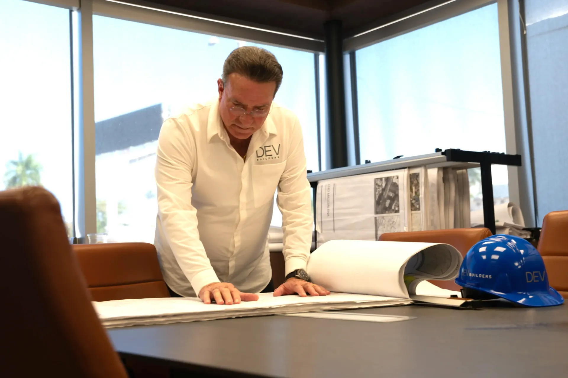 DEV Builders workers looking at blueprints