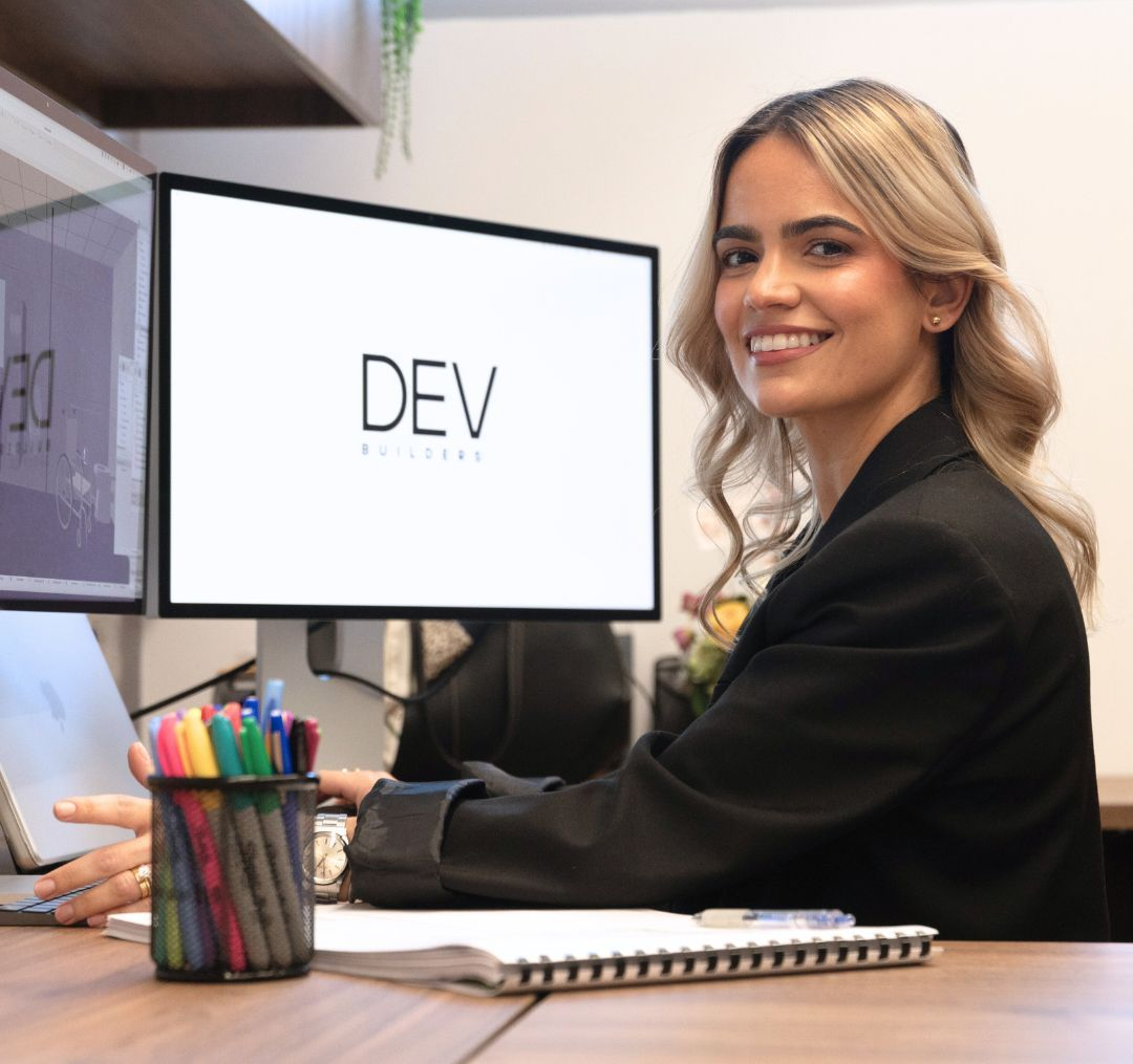 DEV Builder employee reading blueprints