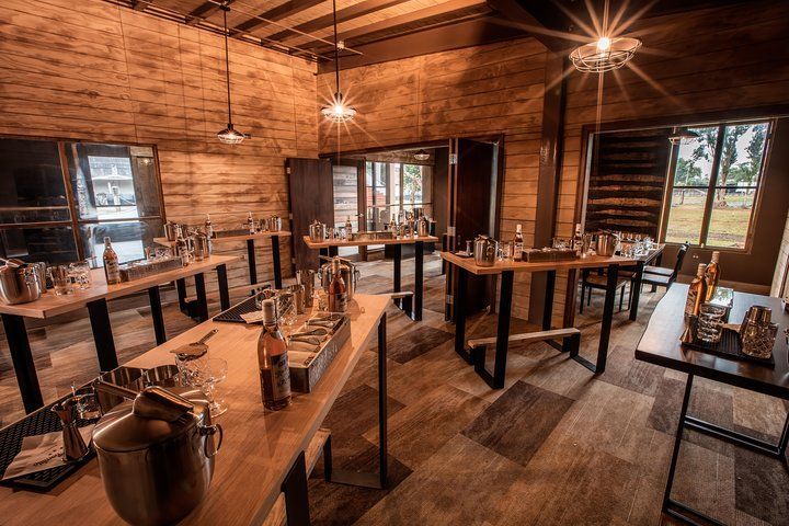 A large wooden room dedicated to mixology class in Ron del Barrilito's Visitor Center built by DEV Builders Group.