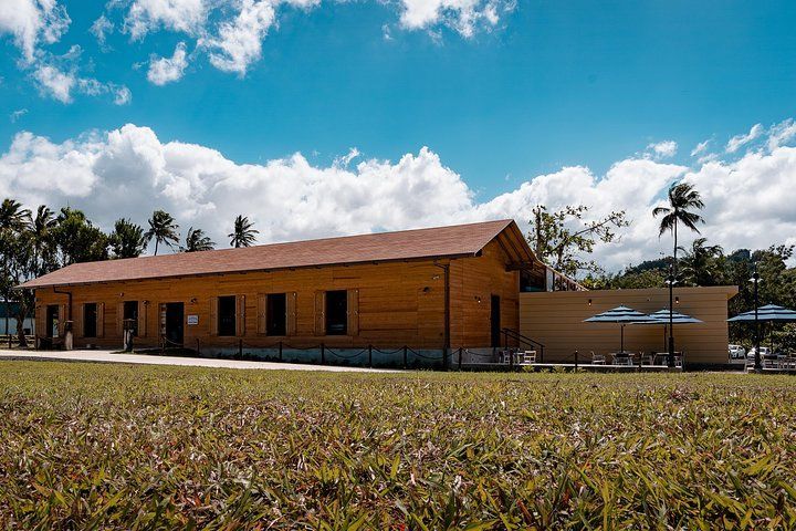 Outside view of Ron del Barrilito's Visitor Center in the middle of a grassy field built by DEV Builders Group.