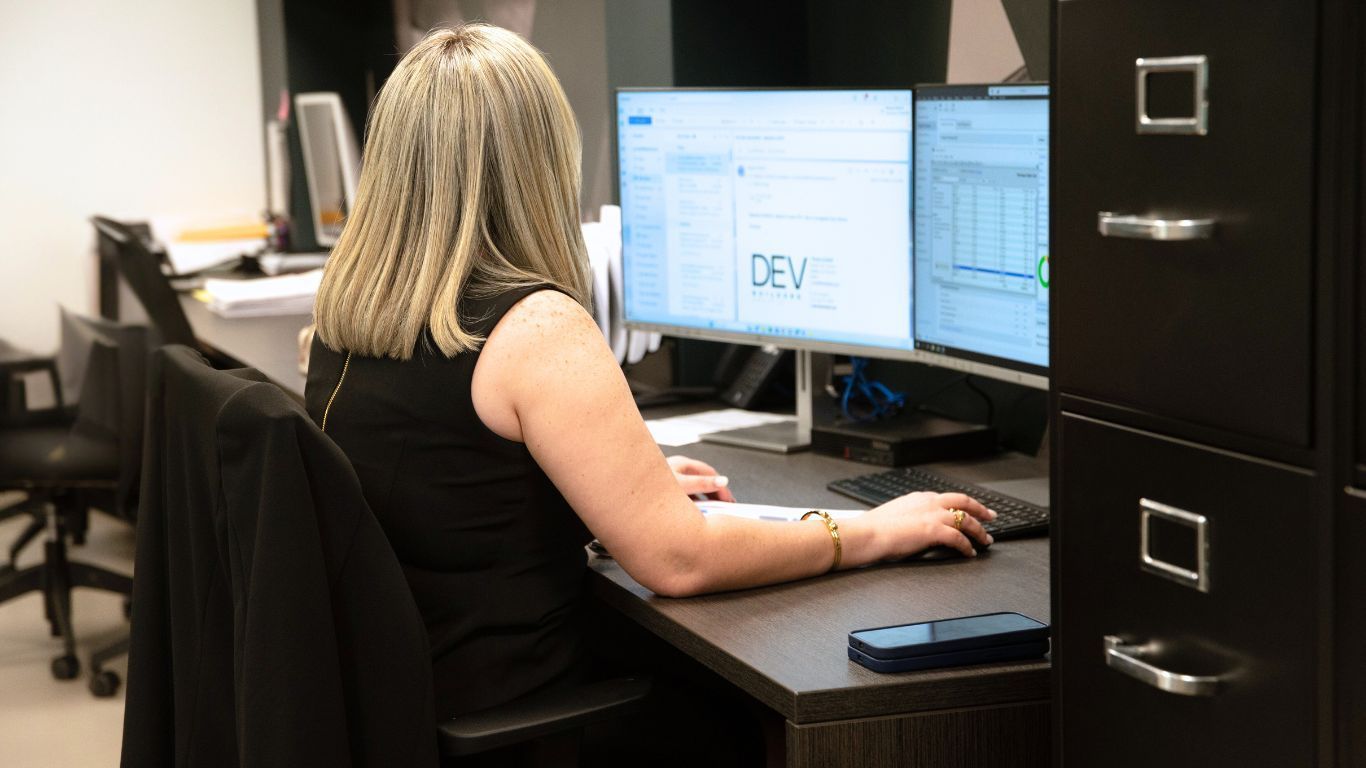 DEV Builders executive working in project management