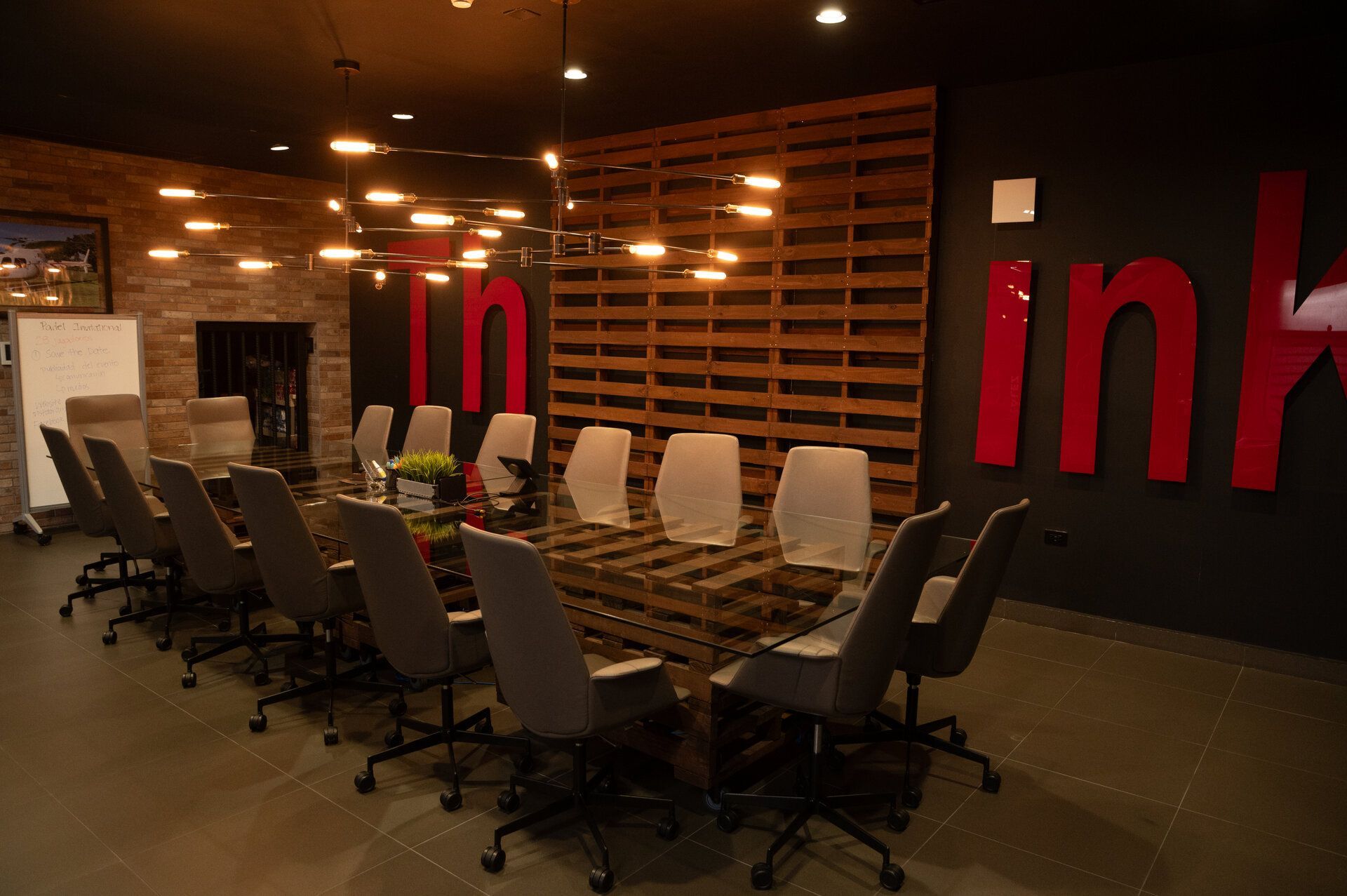 Conference room with long table, chairs, and