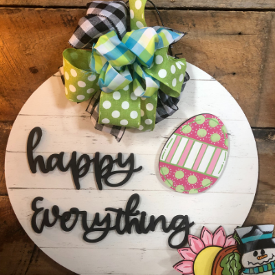 “Happy Everything” round sign with colorful bow and Easter egg decorations