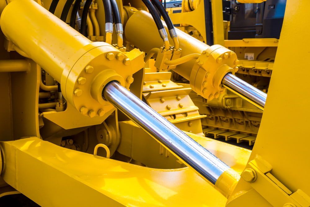 Hydraulic Piston Cylinder System Of Yellow Bulldozers — Rowdraulics NQ Pty Ltd in Moranbah, QLD