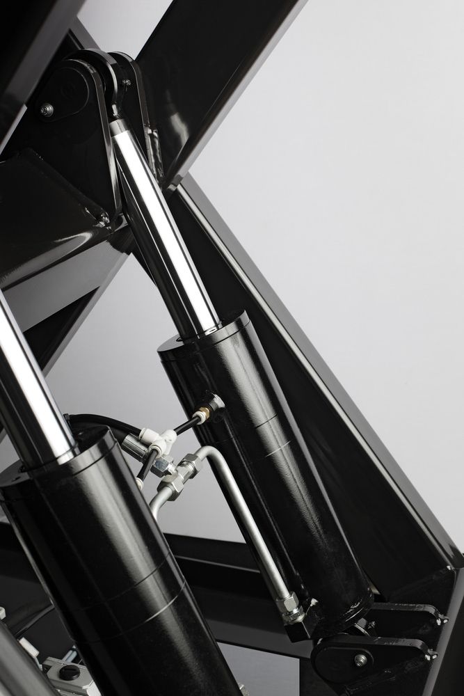 A Close Up of Hydraulic Cylinders on a Machine — Rowdraulics NQ Pty Ltd in Mount Louisa, QLD