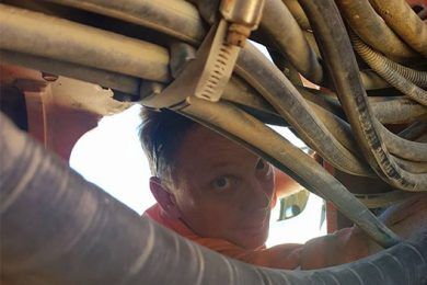 Worker Repairing Hydraulic Hoses — Rowdraulics NQ Pty Ltd in Mount Louisa, QLD