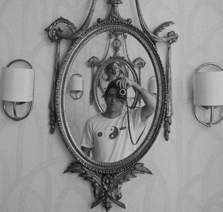 Rahm Carrington, the co-founder of C-Roll Productions, taking a photo of himself in a mirror.