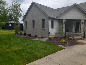 green lawn, flower beds