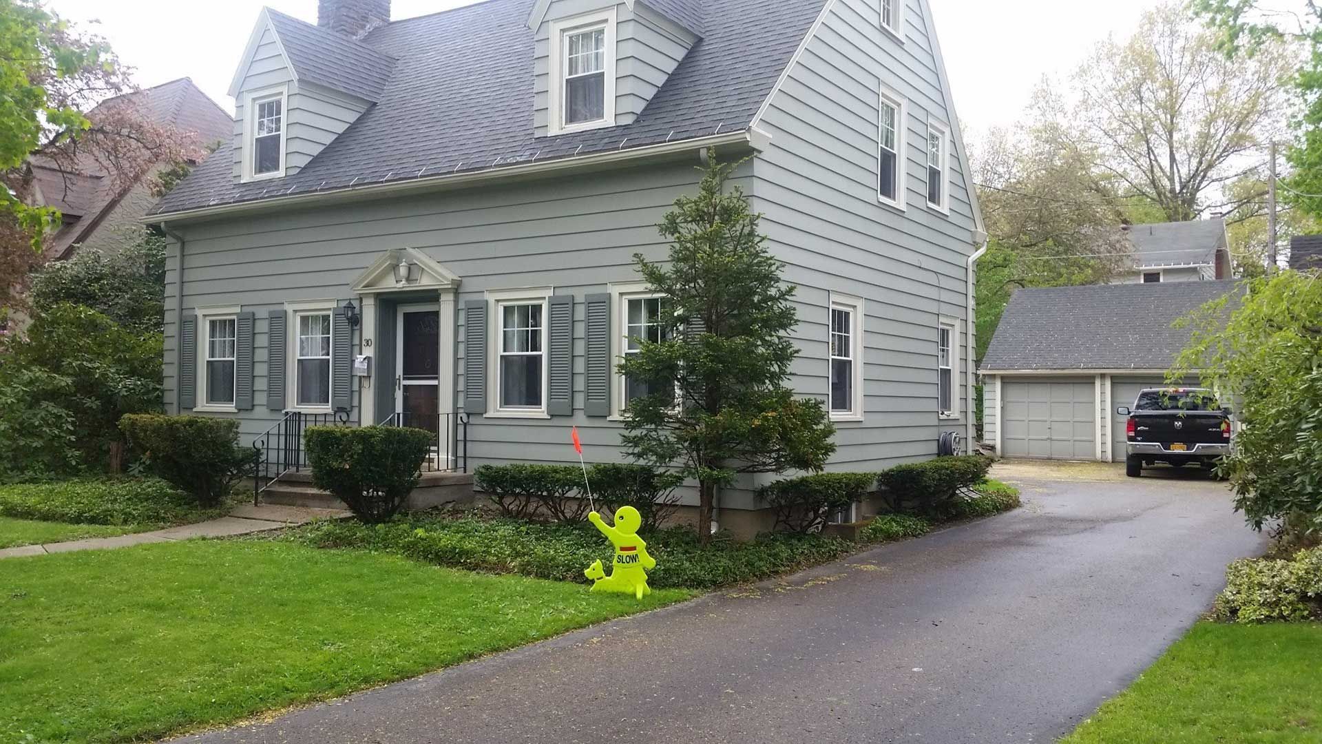 front right of gray house without landscaping