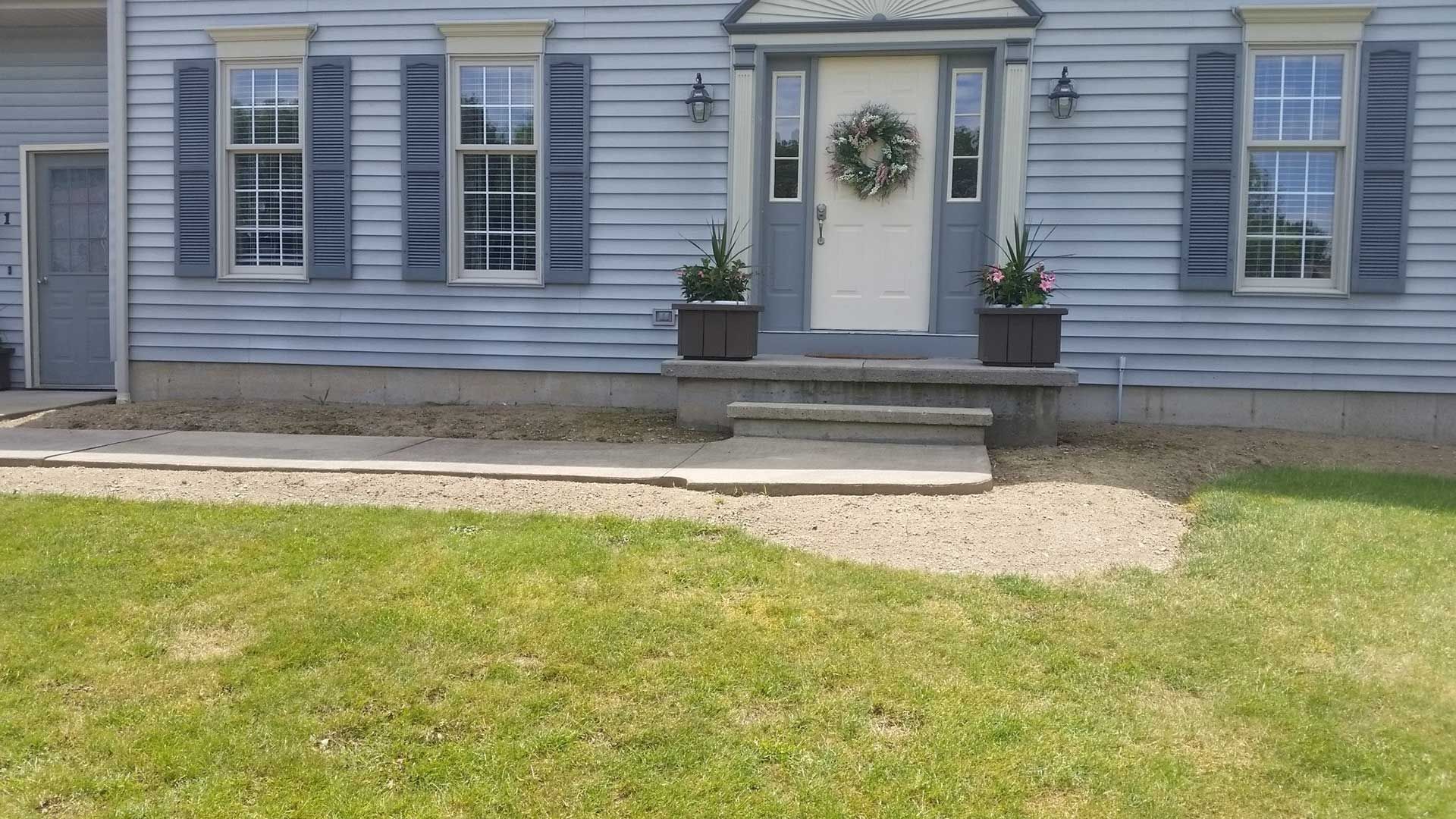 front door and porch of blue house