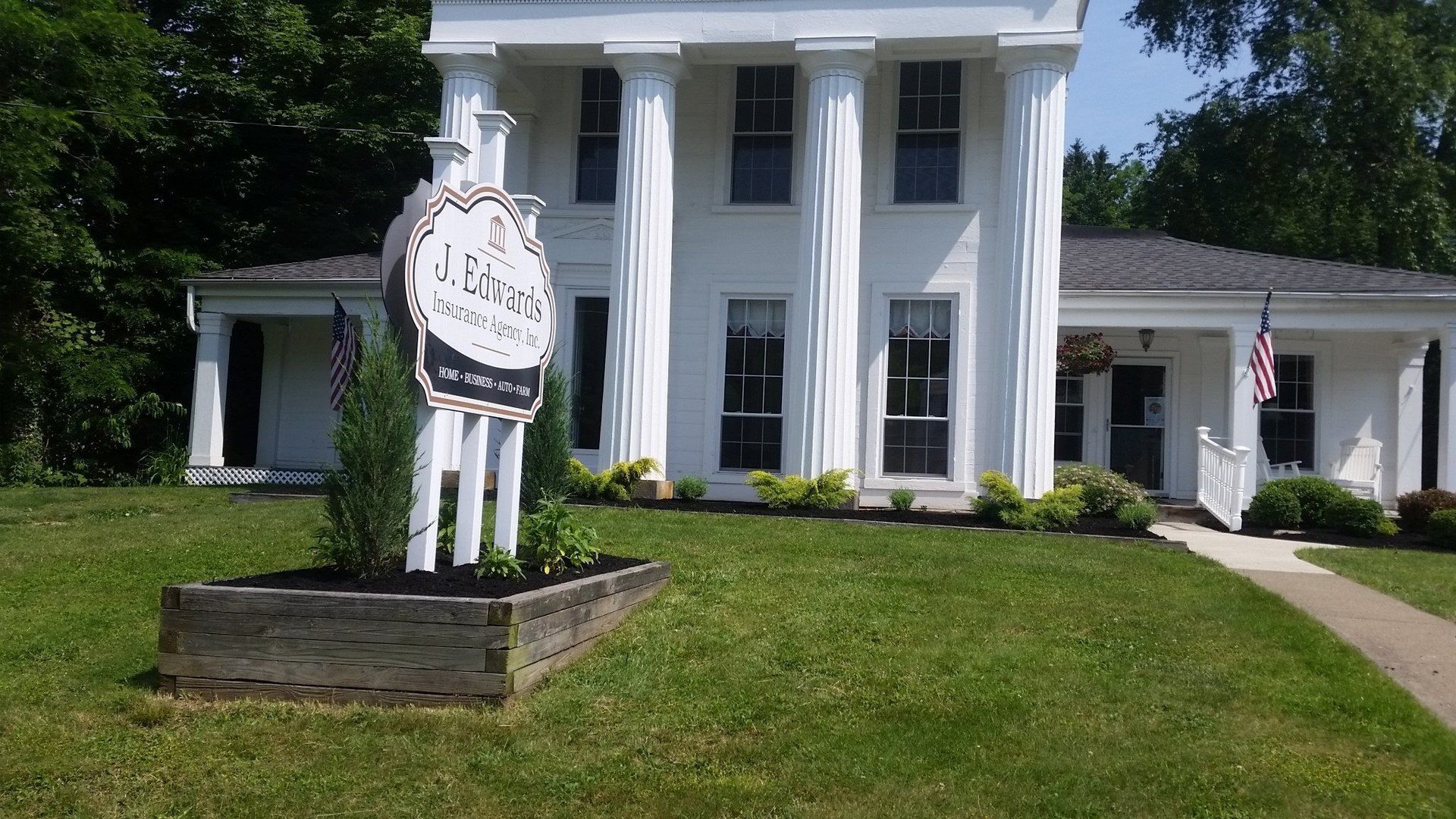 fresh landscaping in front of a business sign