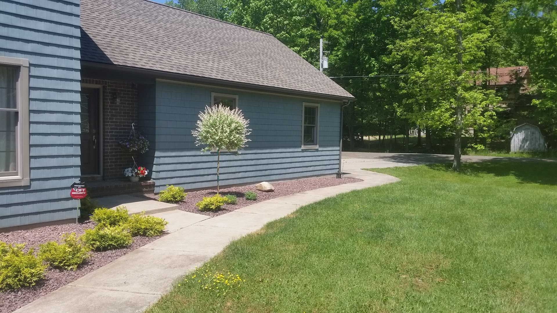 side of house with landscaping