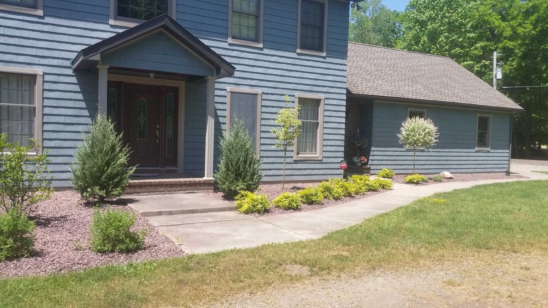 front right side of house with landscaping