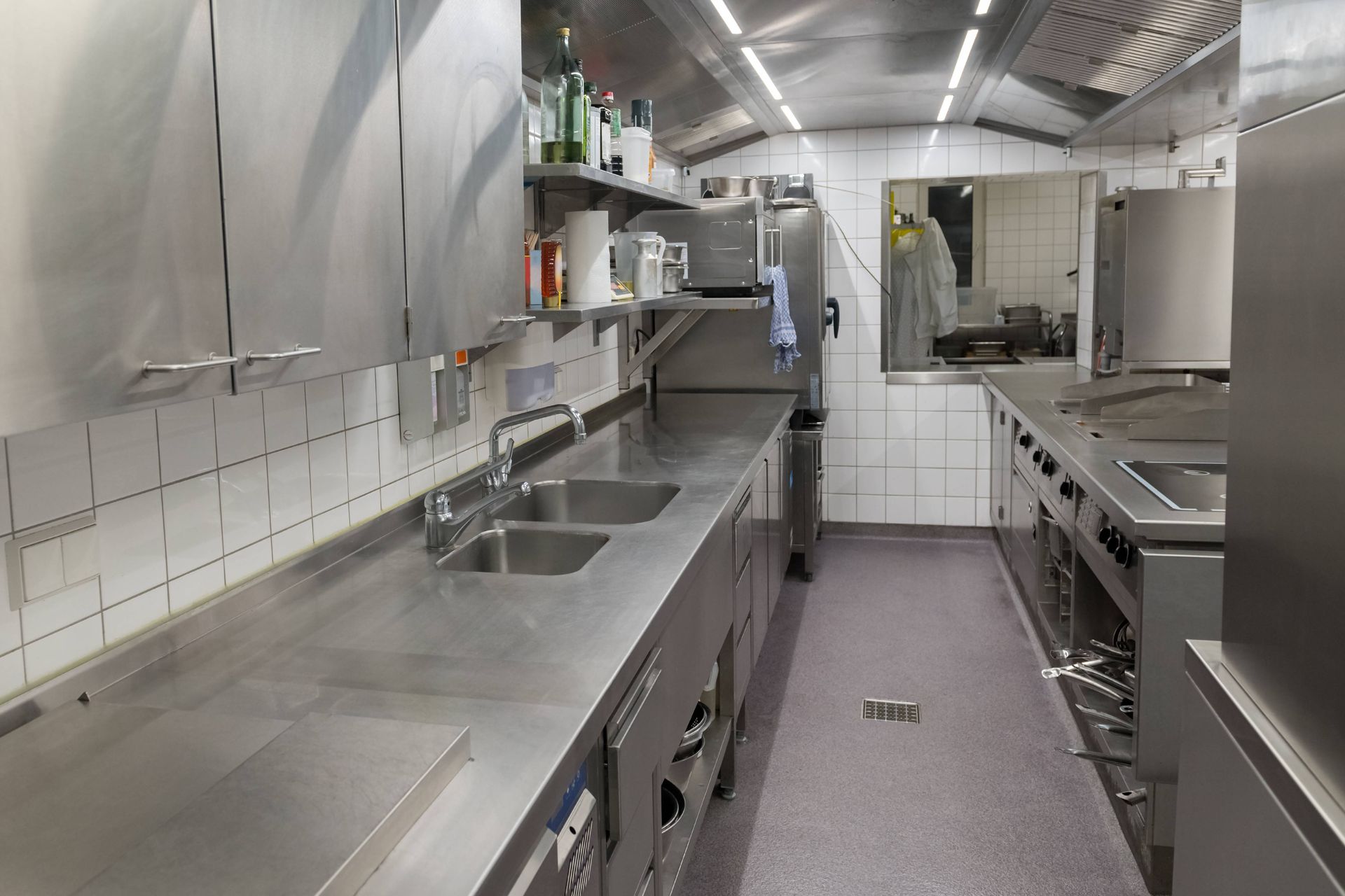 A restaurant kitchen with a custom concrete coating floor  at Resilient Concrete Coatings near Cypress Texas (TX)