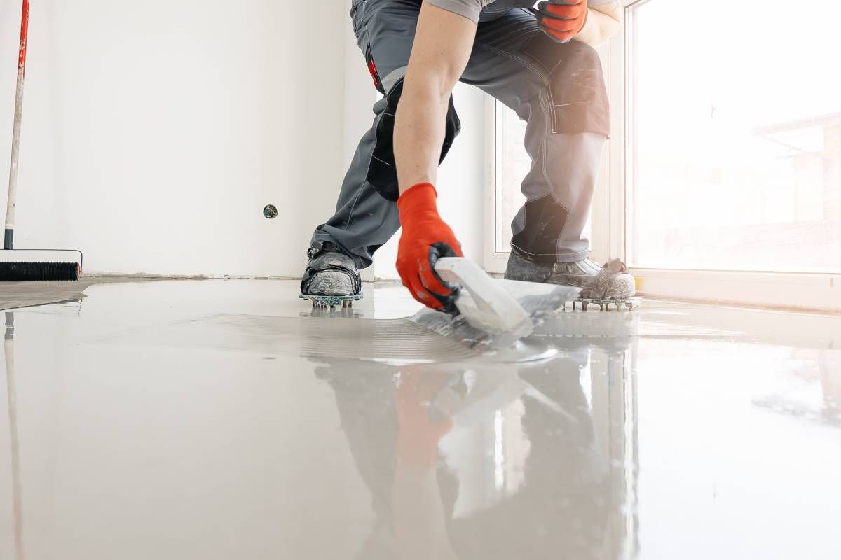 Someone applying a final layer of a concrete coating at Resilient Concrete Coatings near Cypress Texas (TX)