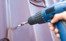 worker using a driller