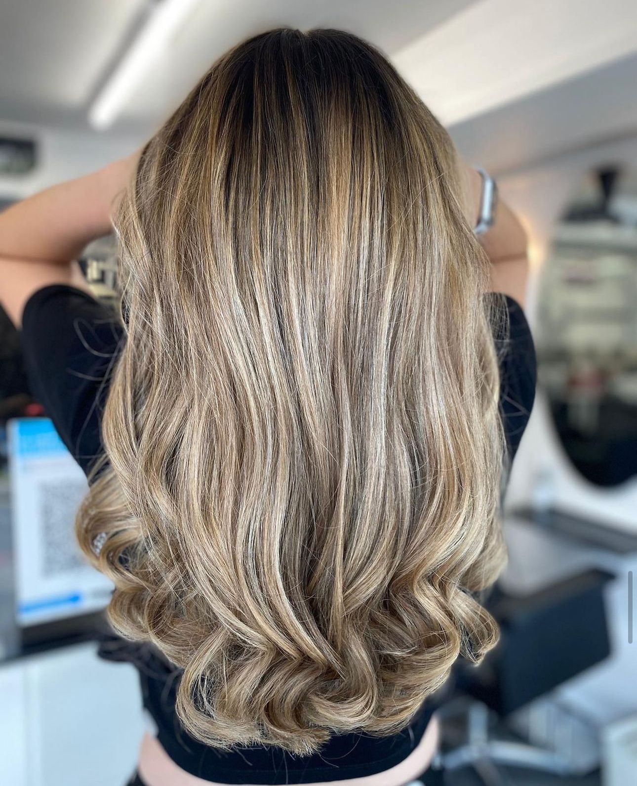 A woman has just had balayage treatment for her hair at panache hair and beauty salon