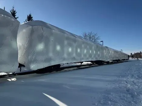A train car is covered in snow and ice.