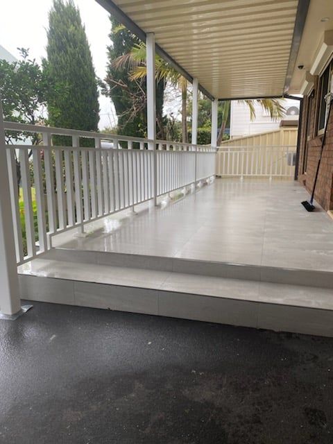 Porch With A White Railing And Steps - Balustrades Newcastle, NSW