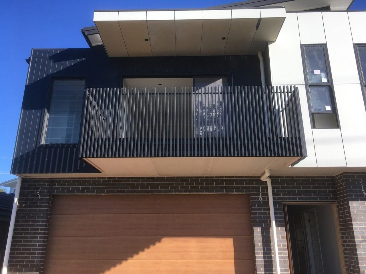A House With A Lawn And A Hose In A Yard - Aluminium Manufacturer in Newcastle, NSW