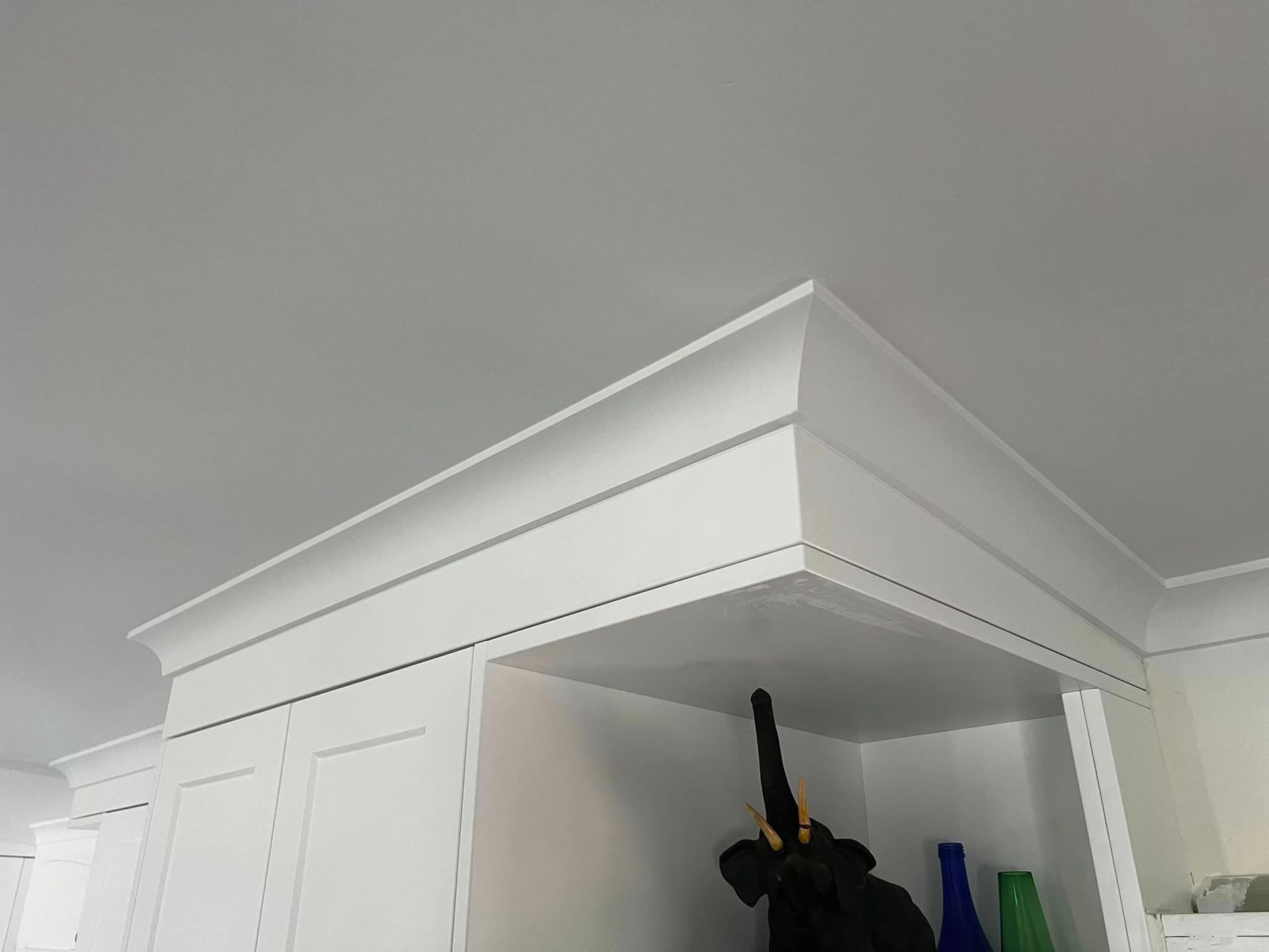 A Corner of a Room With White Cabinets and a White Ceiling — Poljak Plasterers in North Ward, QLD