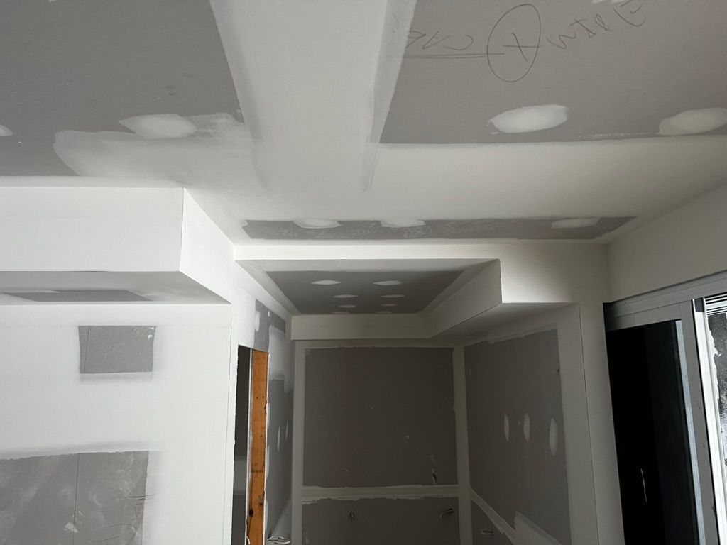 Worker Hands Using Spatula and Plastering Wall — Poljak Plasterers in Rosslea, QLD