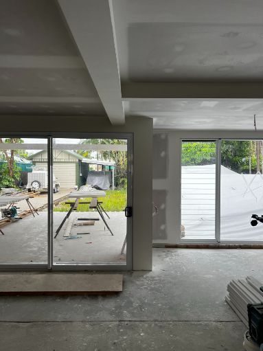 A Room With a Lot of Windows and a View of a Yard — Poljak Plasterers in Hermit Park, QLD