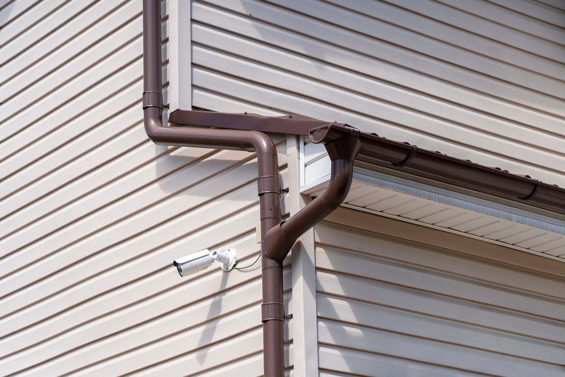 House with siding next to brown gutter — Morehead City, NC — F&R Construction