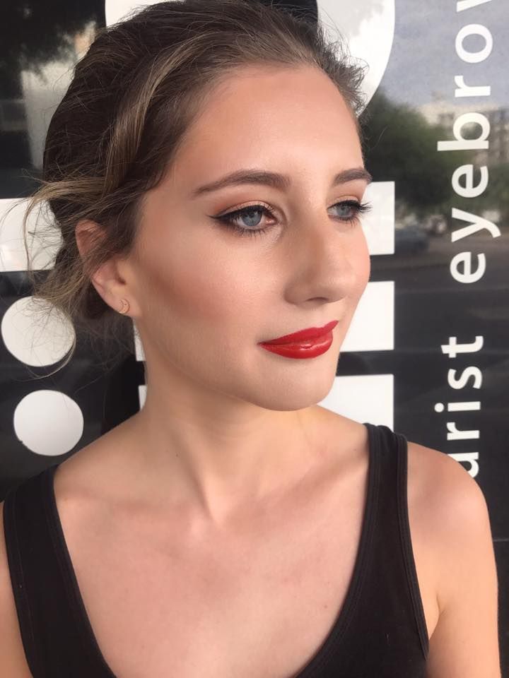 Woman With Red Lipstick and Winged Eyeliner Posing — Miilan Hair in Darwin City, NT