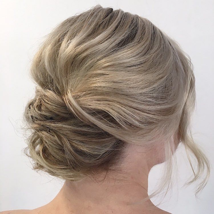 Elegant Blonde Updo Hairstyle With Soft Twists and Loose Strands — Miilan Hair in Darwin City, NT