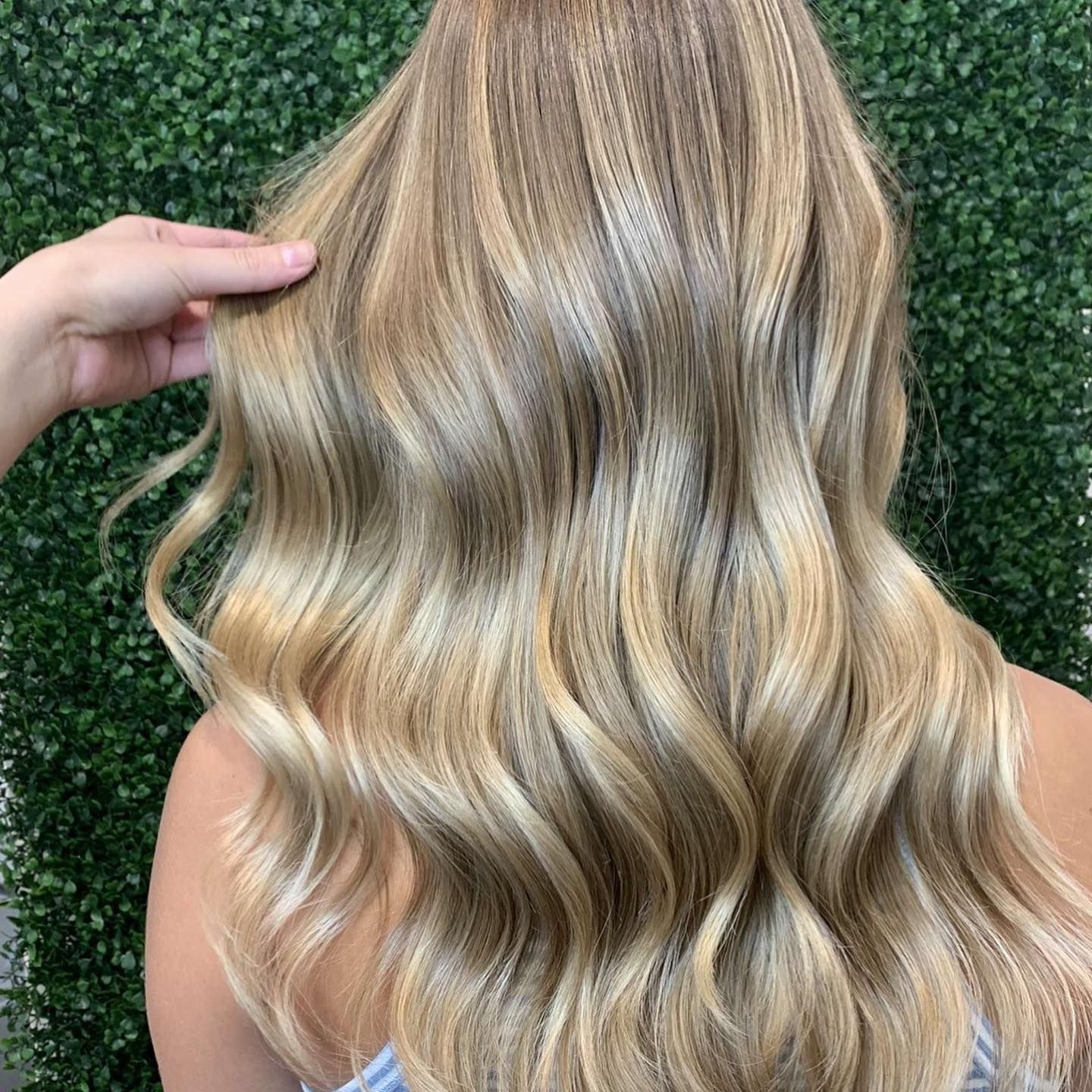 Wavy Blonde Hair With Soft Highlights, Shown From the Back — Miilan Hair in Darwin City, NT