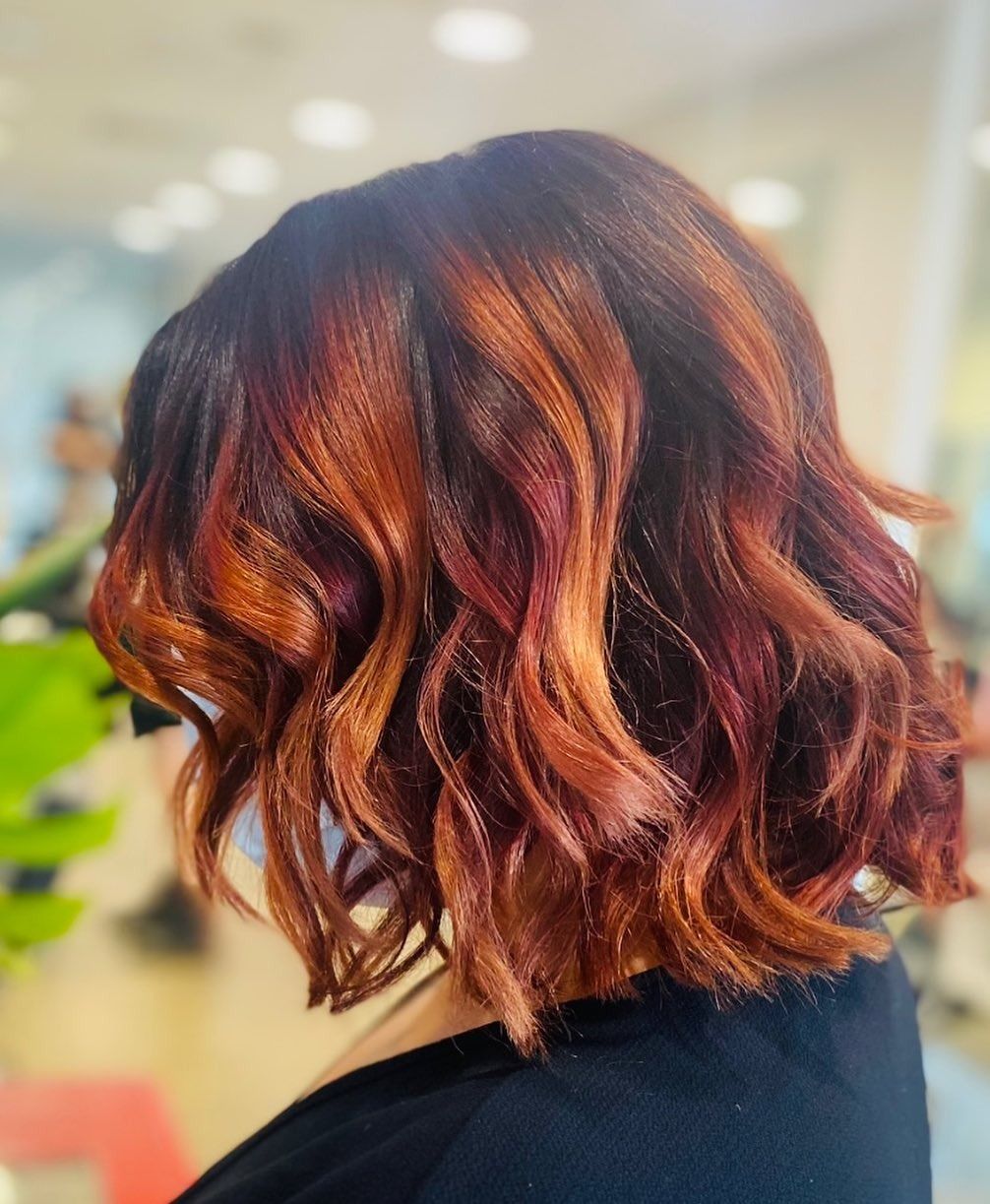 Short Wavy Copper-red Bob Hairstyle Shown From the Back in a Salon Setting — Miilan Hair in Darwin City, NT