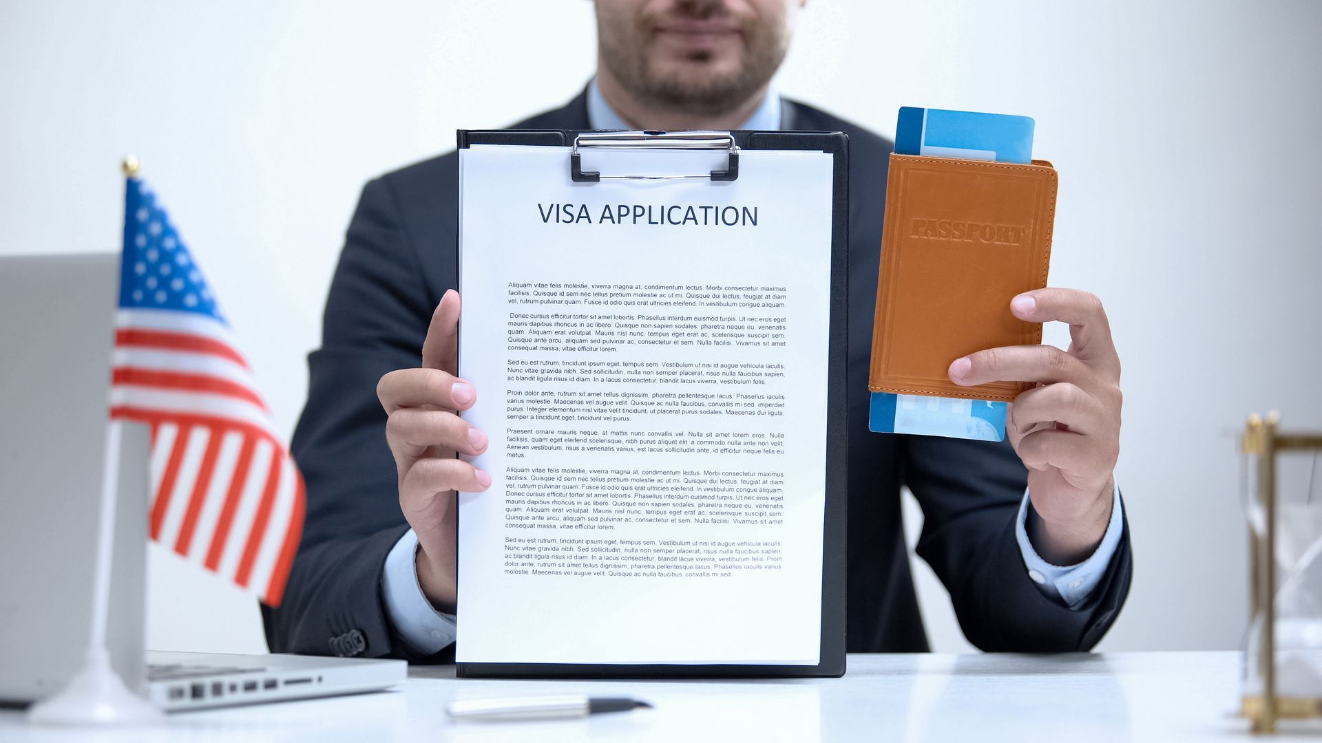 Visa application lawyer presenting official visa application documents.