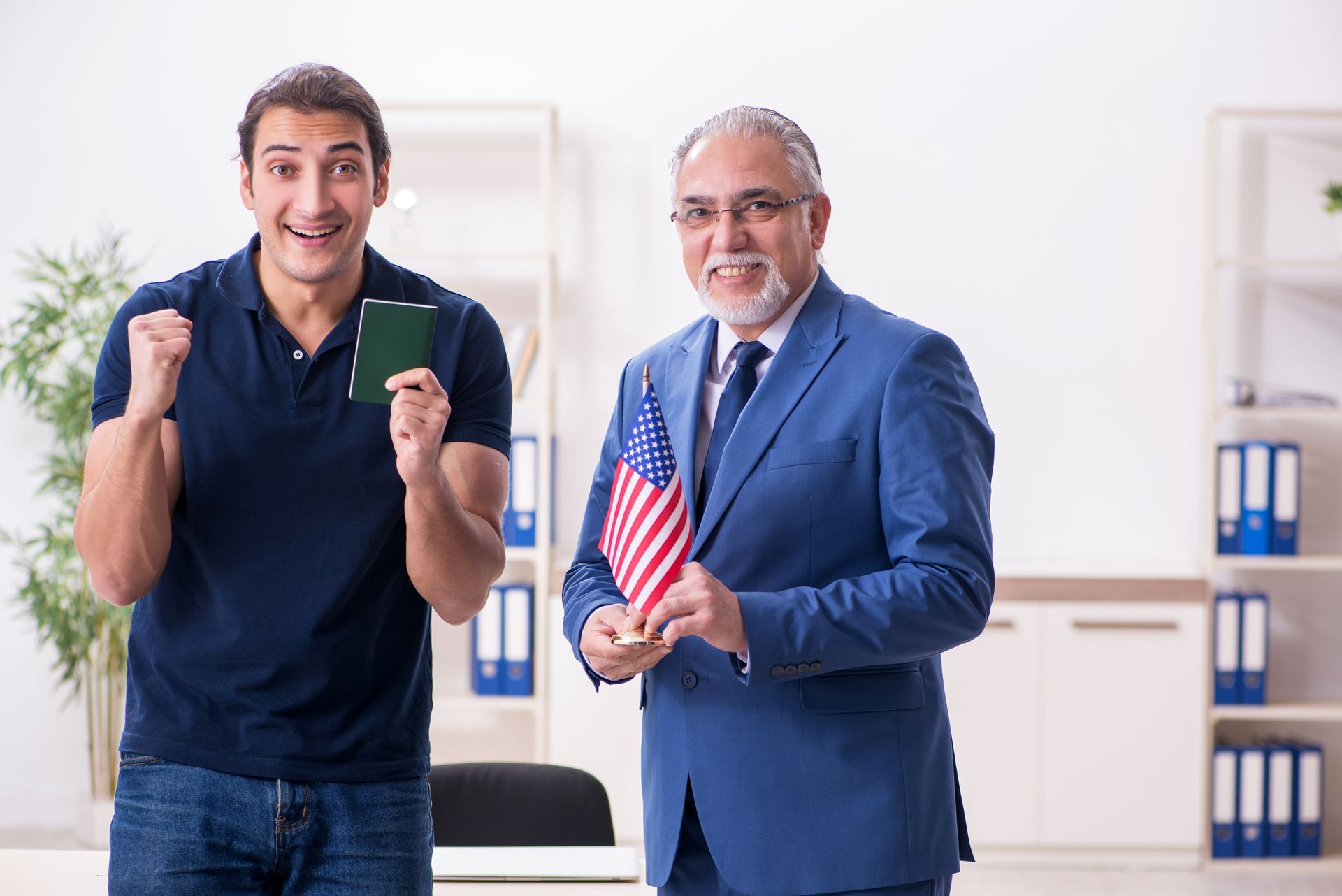 A visa application lawyer celebrating a client's visa approval in the office. A visa application lawyer celebrating a client's visa approval in the office.
