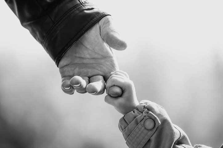 Child Holding Adult Hand
