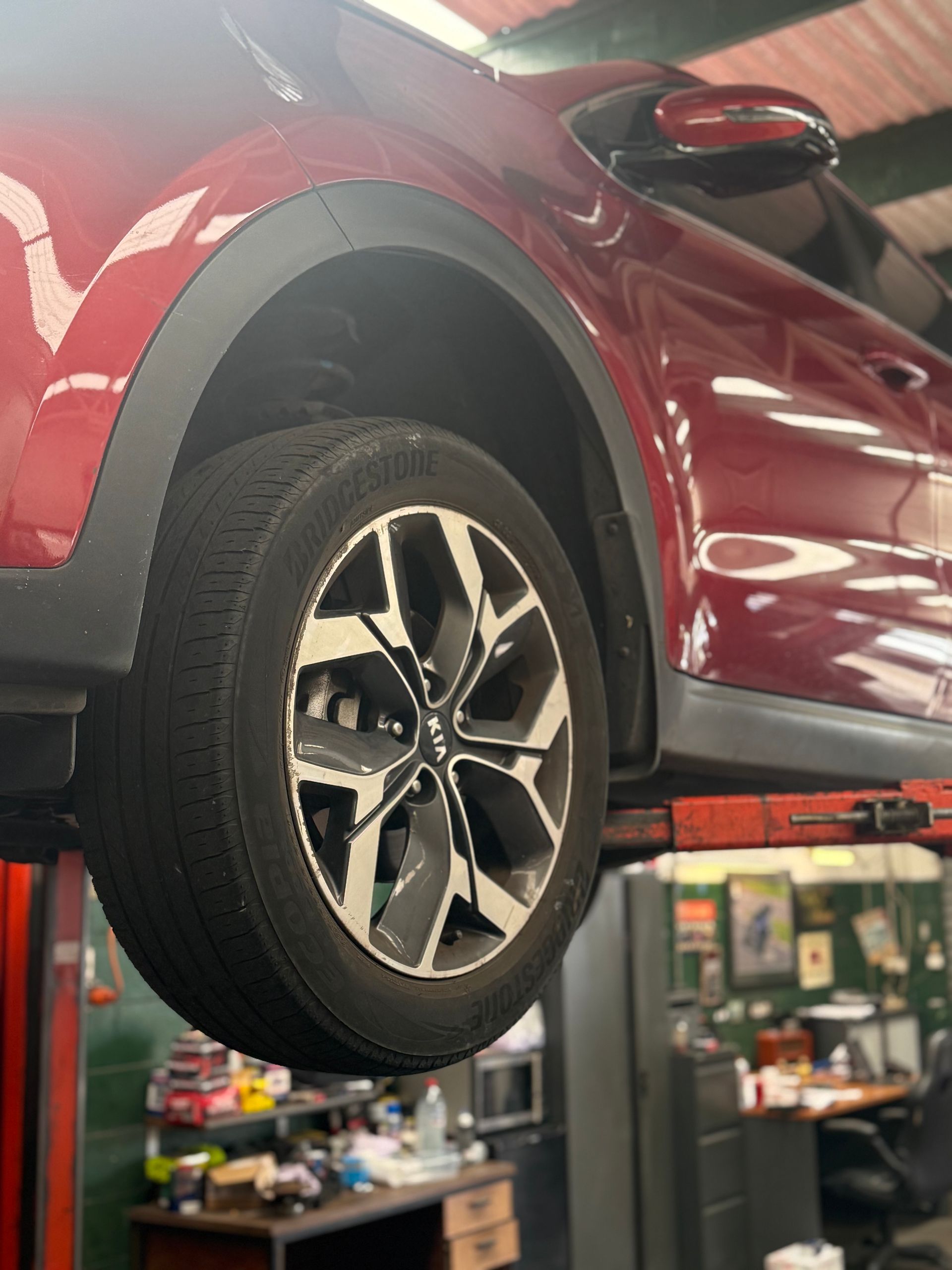 A Car is Being Aligned With a Machine in a Garage — Fix-It Automotive in Fairy Meadow, NSW