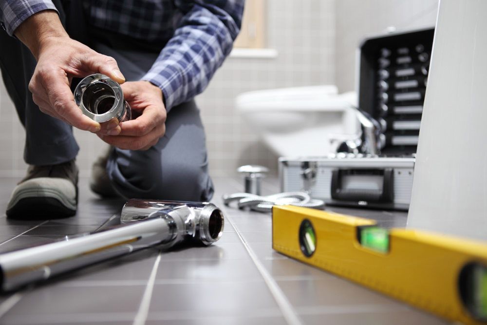 Plumber Installing Plumbing in a Bathroom. Tools on Floor — Expert Plumbing & Solar Services Bathurst in Blayney, NSW